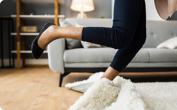 Woman falling on carpet