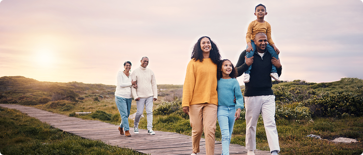 Family walking together at sunset