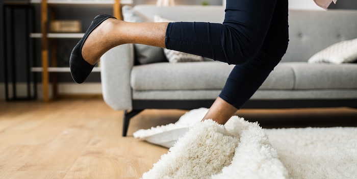 Woman falling on carpet