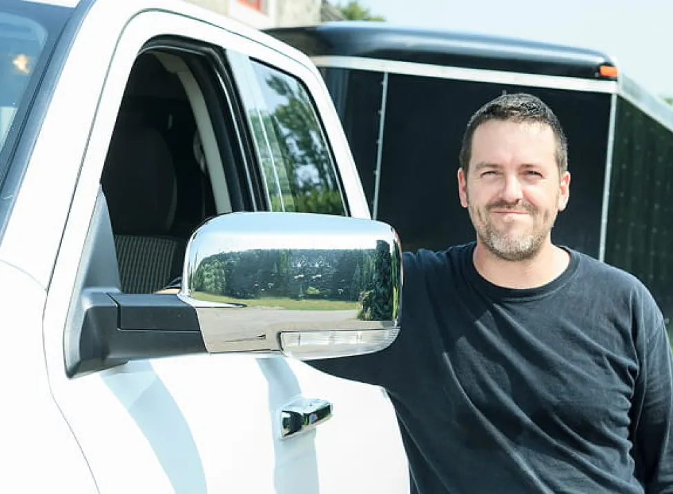 Small business owner with his truck and attached trailer